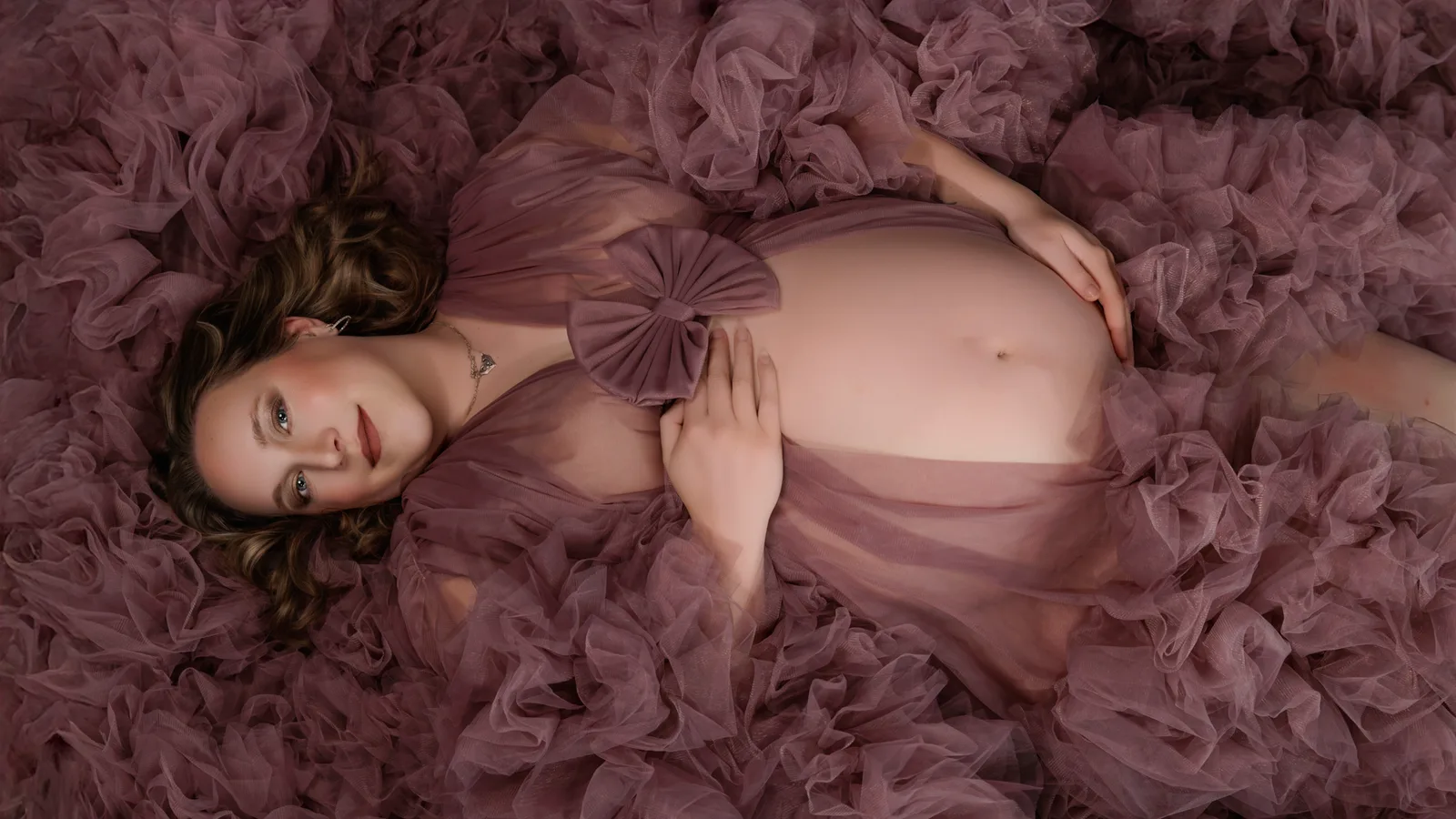 Studio maternity portrait with soft directional lighting